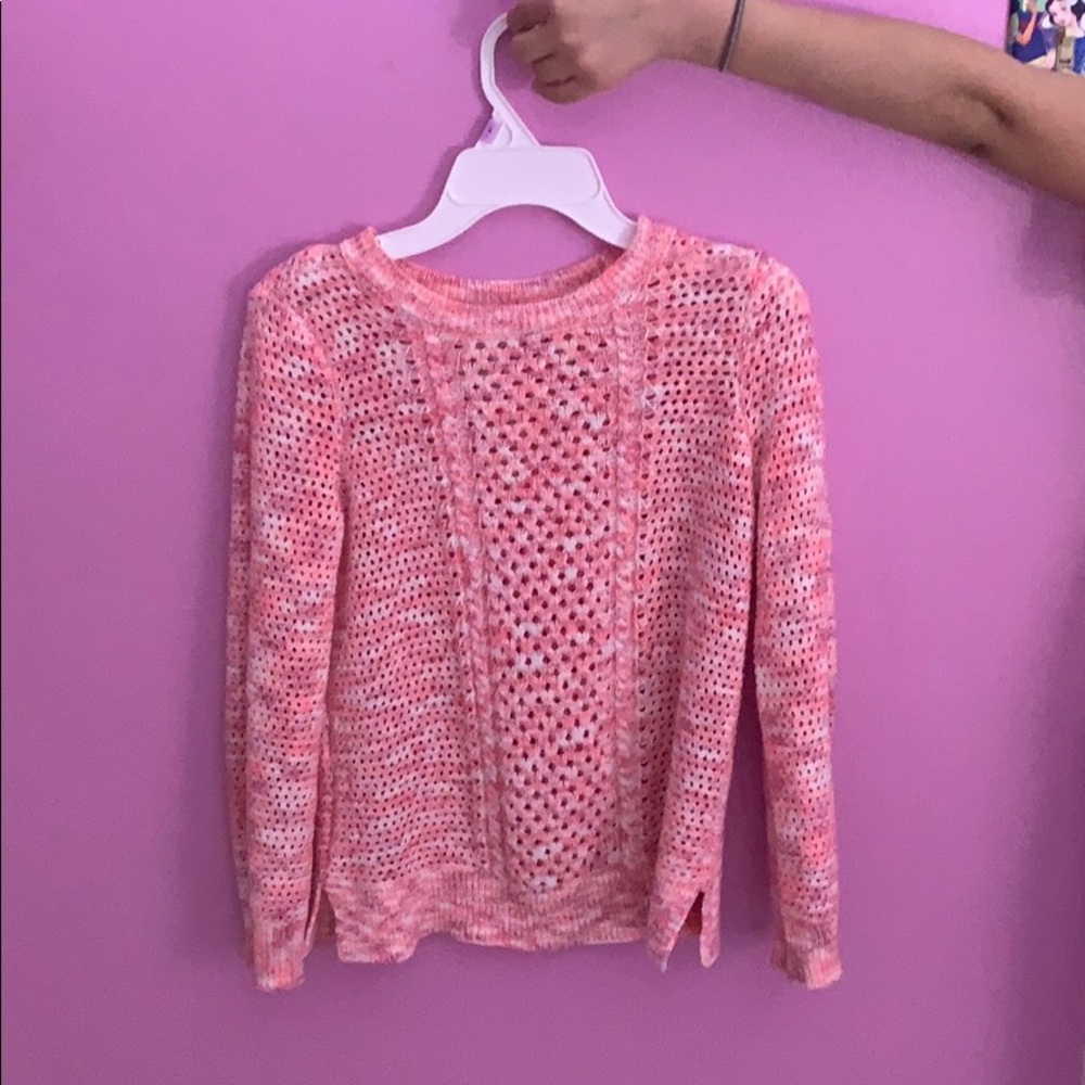 This a pink and white cute sweater